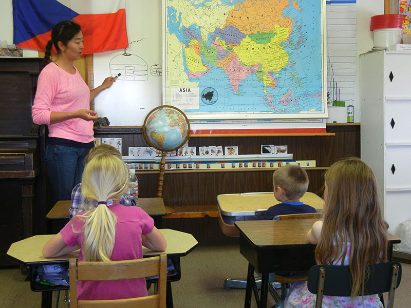 BioRegions staff and Montana State University graduate student Badmaa Dovchin explaining Mongolia land and culture to students in Tallow Creek School