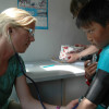 Nurse Amy Braaksma measuring blood pressure during the Bayanzurkh health screening